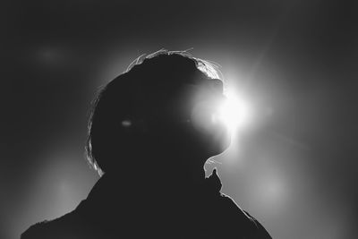 Portrait of silhouette man against illuminated light