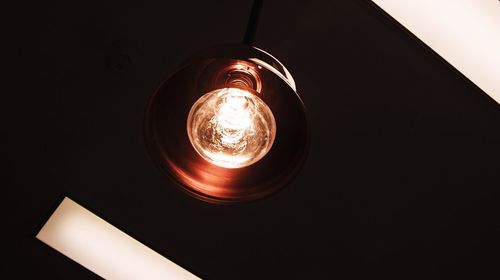 Low angle view of illuminated light bulb