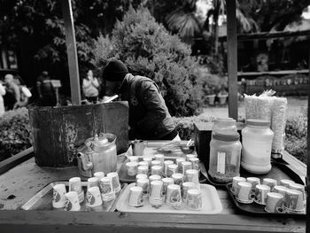 Man selling tea at market stall