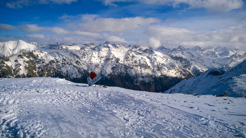 Scenic view of snowcapped mountains against sky