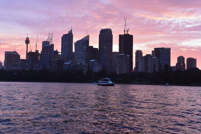 View of modern buildings against sky during sunset