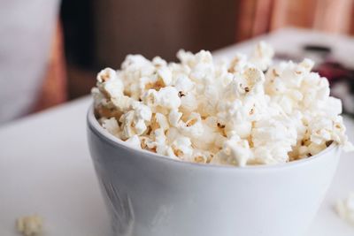 Close-up of popcorns in bowl on table
