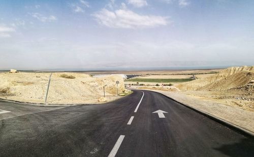 Empty road along landscape