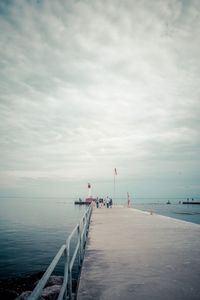 Pier over sea against sky