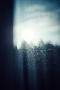 Close-up of wet rain against sky at night