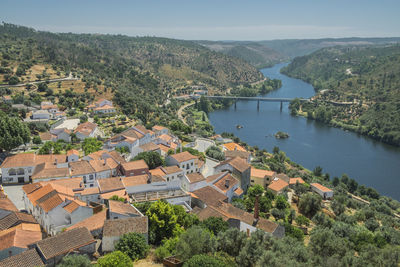 High angle view of townscape by river