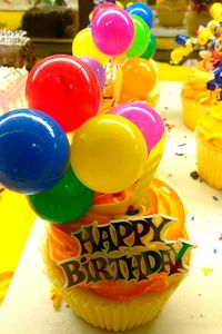 Close-up of multi colored balloons on table