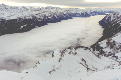 Scenic view of snowcapped mountains against sky