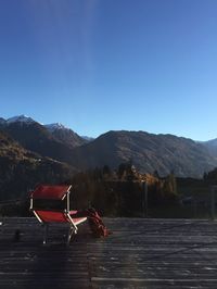 Deck chair overlooking rocky landscape