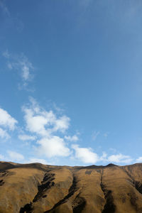 Scenic view of landscape against blue sky