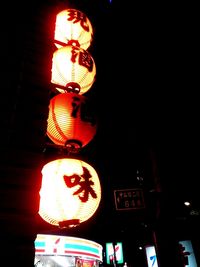 Low angle view of illuminated lamp post