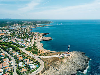 High angle view of sea and buildings against sky