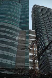 Low angle view of modern buildings against sky in city