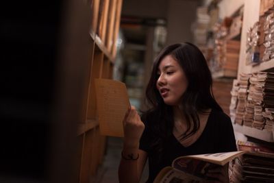 Woman searching in library