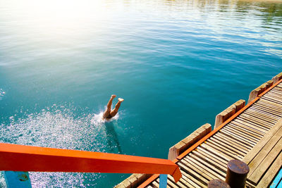 High angle view of man on pier over sea