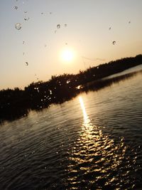 Scenic view of wet sky during sunset