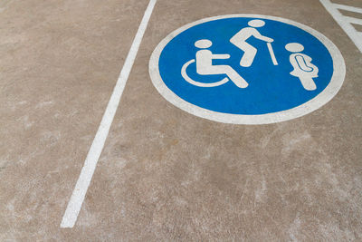 Image of free space blue point of cars parking area with wheelchair-elderly-pregnant woman sign