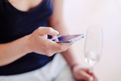 Close-up of woman hand holding mobile phone