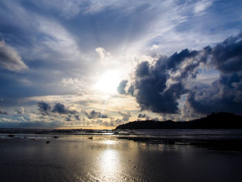 Scenic view of sea against cloudy sky