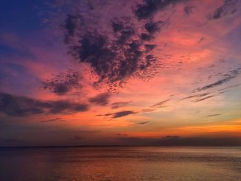 Scenic view of sea against orange sky