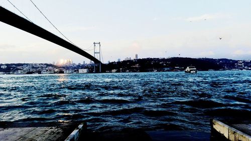 Bridge over sea against sky