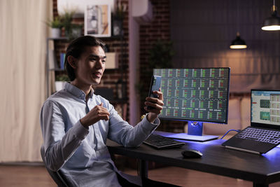 Businesswoman using laptop at office