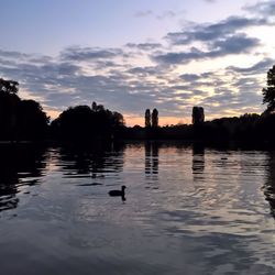 Scenic view of lake at sunset