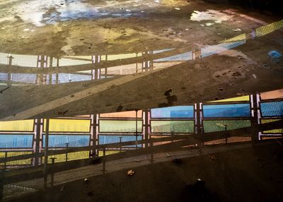 Scenic view of beach seen through bridge