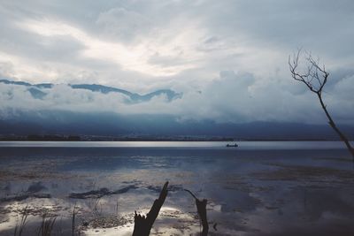 Scenic view of landscape against cloudy sky