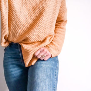 Midsection of woman wearing mask against white background