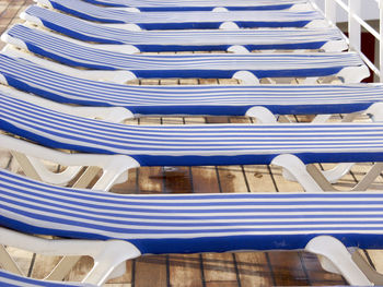 Row of lounge chairs on boat deck