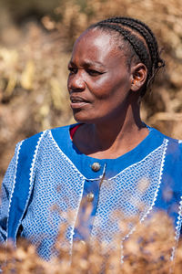 Mid adult woman standing outdoors