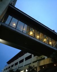 Low angle view of illuminated building against sky