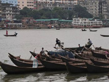 Boats moored in sea