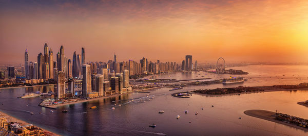 High angle view of city at sunset