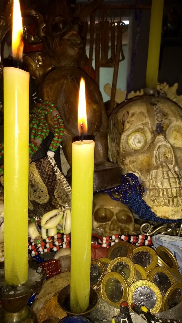 LIT CANDLES IN ILLUMINATED TEMPLE