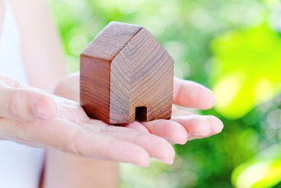 Close-up of hand holding wood