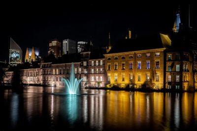 Illuminated buildings at waterfront