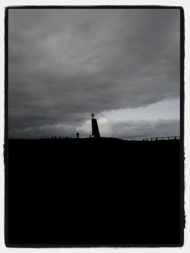 architecture, built structure, sky, building exterior, silhouette, cloud - sky, transfer print, low angle view, cloudy, dusk, auto post production filter, cloud, outdoors, dark, overcast, copy space, no people, weather, nature, tower