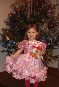 Girl standing on christmas tree