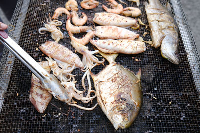 High angle view of seafood on barbecue grill