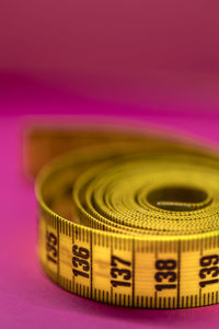 Close-up of pink object over colored background