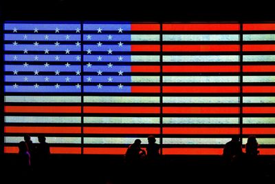 People walking in illuminated city