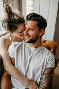 Young couple sitting at home