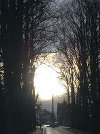 Silhouette bare trees against sky during sunset