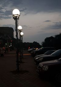 Cars on street in city at dusk