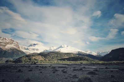 Scenic view of snowcapped mountains against sky