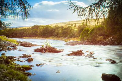 Scenic view of river against sky