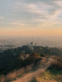 Aerial view of historical buildings against sky during sunset