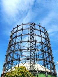 Low angle view of gasometer schoneberg against sky